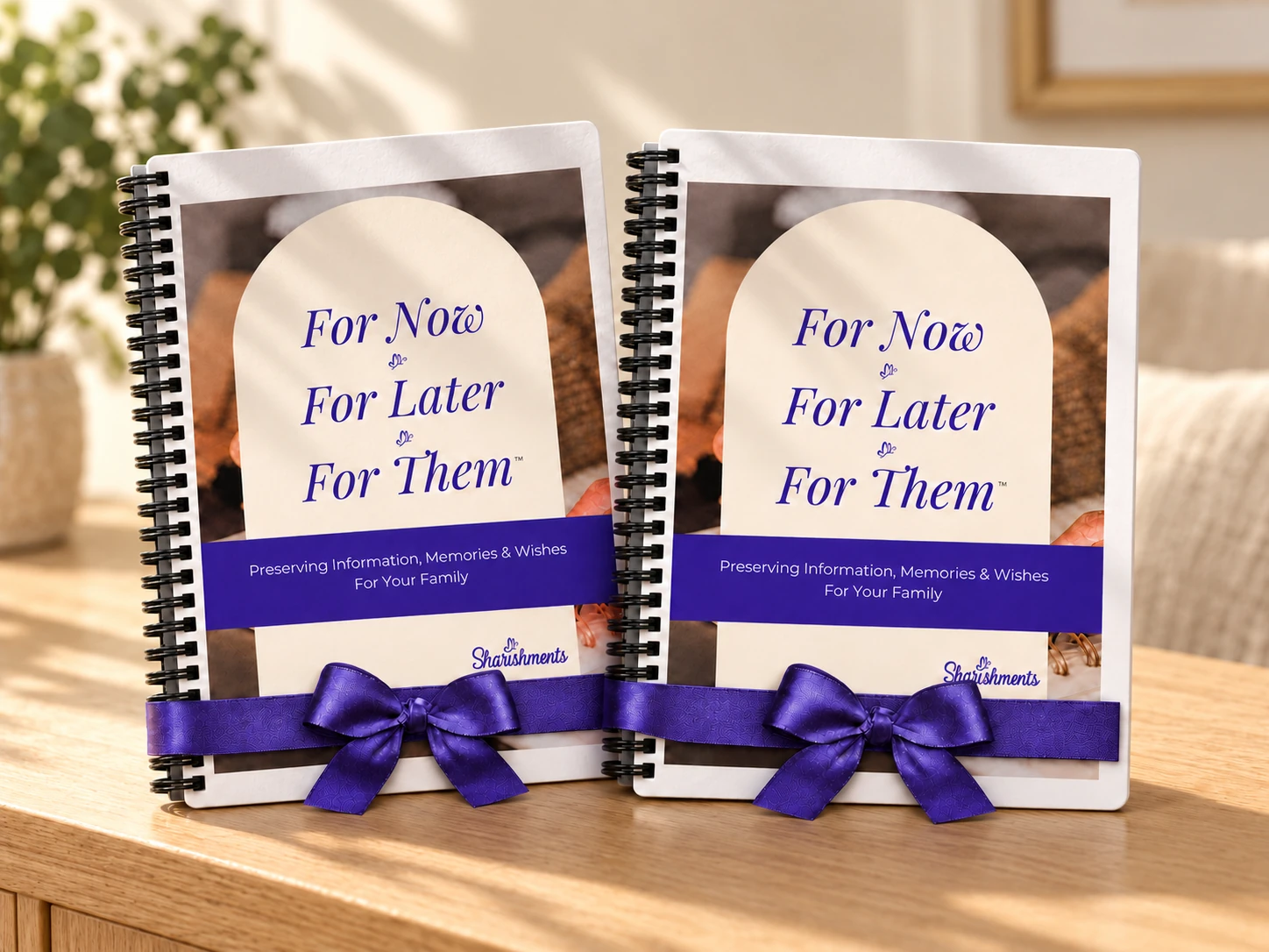 Two printed organizers with purple ribbons on an oak table
